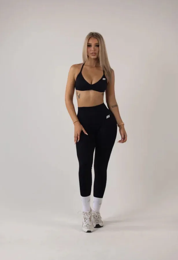 Woman wearing black Ready Or Not Essential Leggings and matching crop top